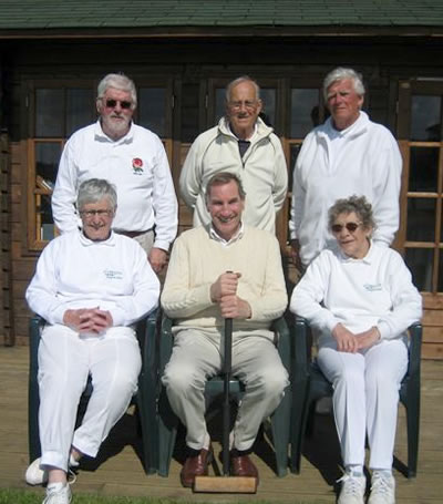 The photo shows both teams, Cornwall standing, 