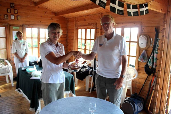 Sue Daw, The Winner, receives the Trophy from Chairman David Edwards