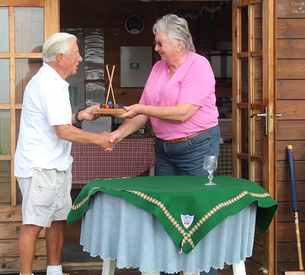 The winner Russell Moore receives The Trophy from Joyce Wilson