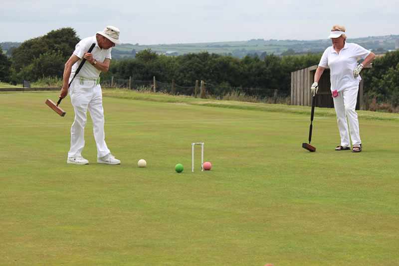 Afternoon Singles Sidmouth's green trying to block Cornwall's white