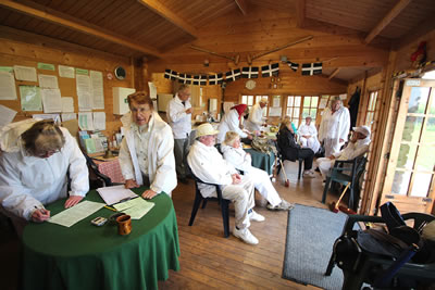 Teams enjoying a hot cup of tea while waiting for results